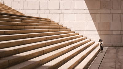 toddler Standing Infront of Steps